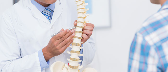 chiropractor discussing herniated discs with client