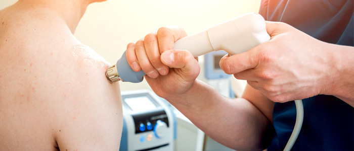 a patient receiving shockwave therapy treatment
